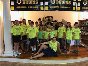 The Red Group posed for a picture with Blades (the Bruins' mascot)